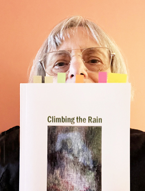 Marvyne Jenoff holding her book, Climbing the Rain